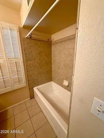 a bathroom with a granite countertop sink a toilet and mirror
