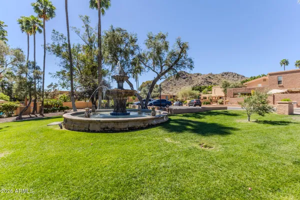 a view of a garden with a fountain