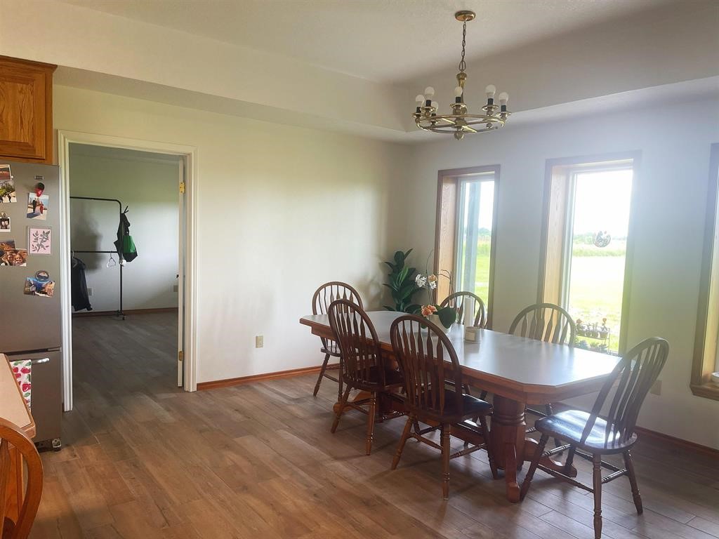 13979 Shellhammer Road Winnie, TX 77665 - Photo 14 of 47 a view of a dining room with furniture window and wooden floor