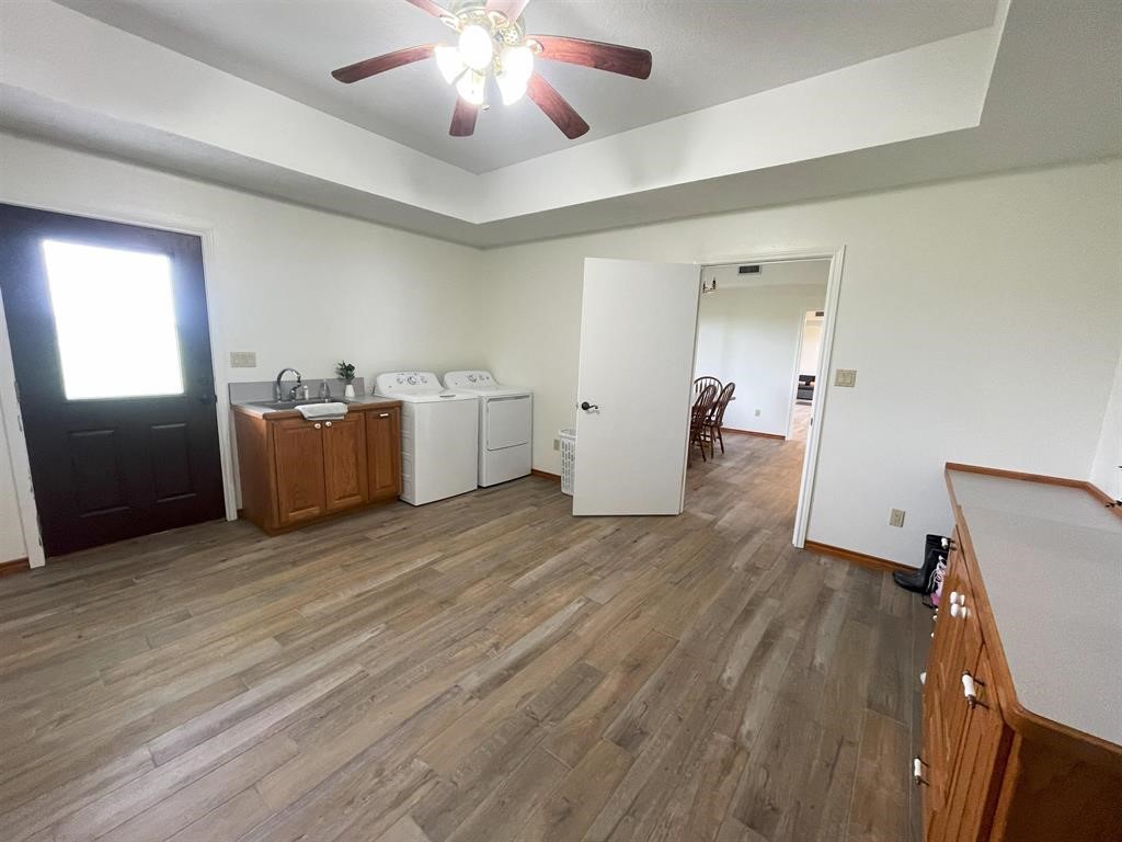 13979 Shellhammer Road Winnie, TX 77665 - Photo 16 of 47 a view of a room with wooden floor and furniture
