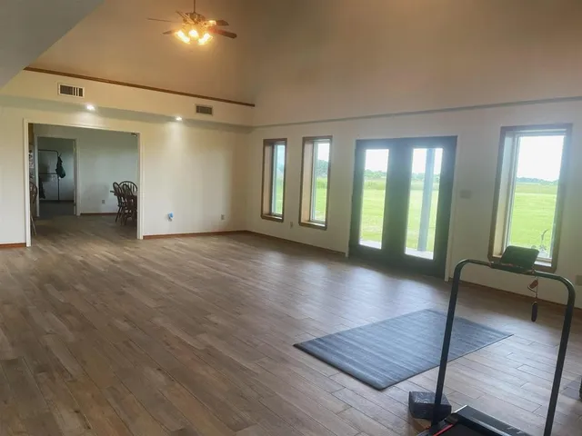 a view of livingroom with hardwood floor and a ceiling fan