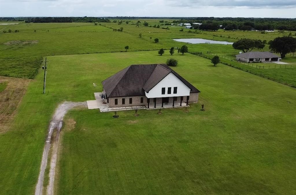 13979 Shellhammer Road Winnie, TX 77665 - Photo 2 of 47 a view of a garden with an outdoor space
