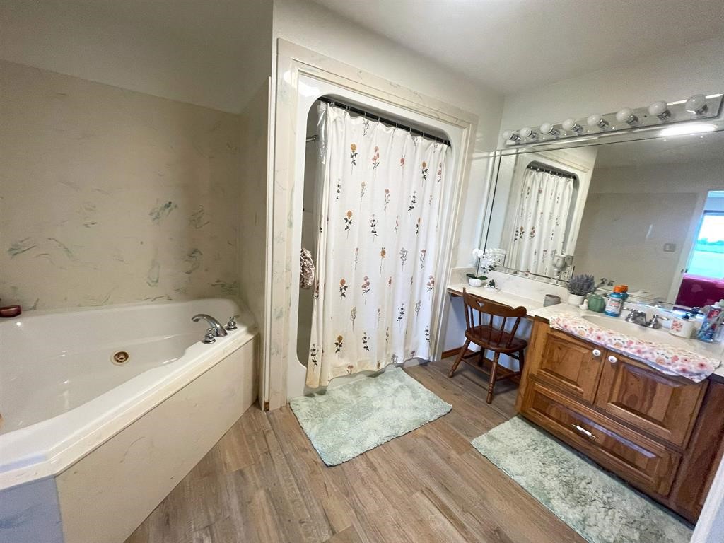 13979 Shellhammer Road Winnie, TX 77665 - Photo 24 of 47 a spacious bathroom with a tub shower and sink