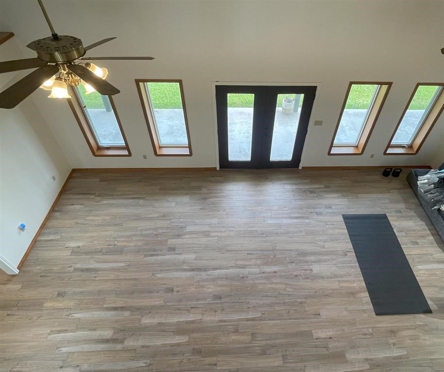 13979 Shellhammer Road Winnie, TX 77665 - Photo 31 of 47 a view of an entryway with wooden floor
