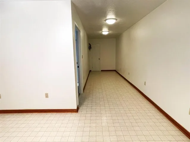 a view of hallway with a front door