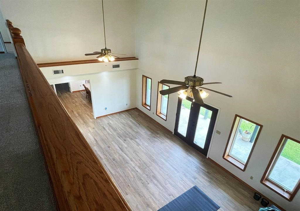 13979 Shellhammer Road Winnie, TX 77665 - Photo 33 of 47 a view of a hallway with wooden floor