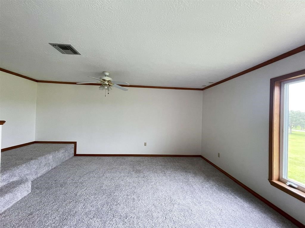 13979 Shellhammer Road Winnie, TX 77665 - Photo 36 of 47 an empty room with a window