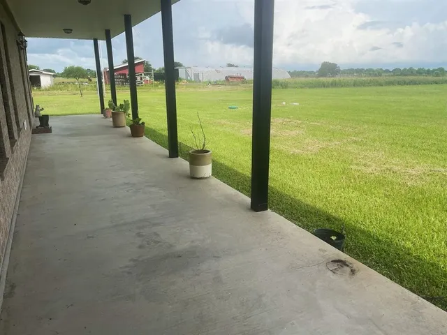 a view of a building with a backyard