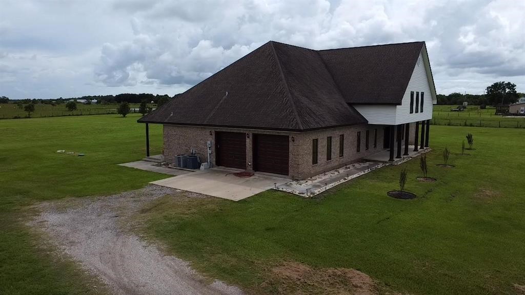13979 Shellhammer Road Winnie, TX 77665 - Photo 6 of 47 a view of a house with backyard and garden