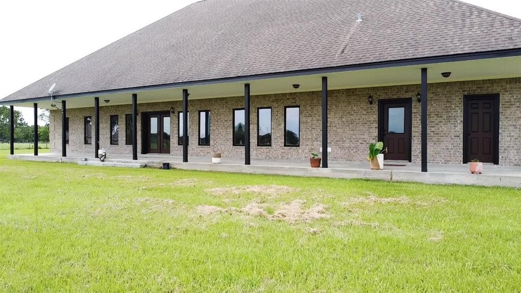 13979 Shellhammer Road Winnie, TX 77665 - Photo 9 of 47 a view of outdoor space yard and porch