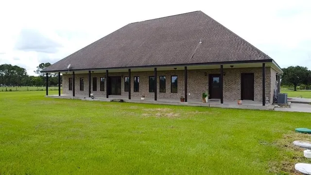 a view of a house with garden and porch