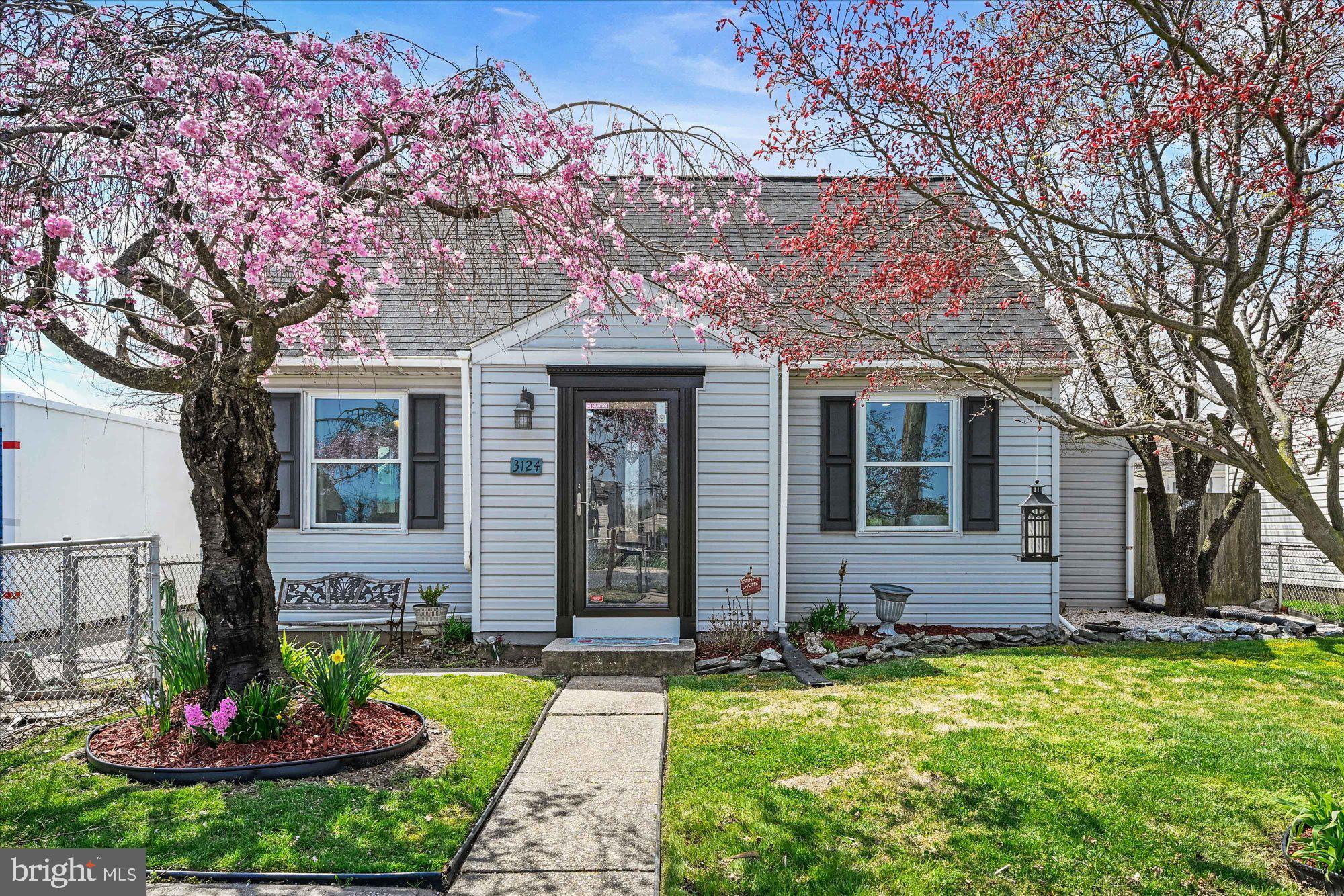 3124 Sollers Point Road Dundalk, MD 21222 - Photo 1 of 24 a front view of a house with a garden and patio