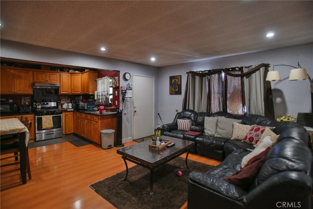 2525 West 10th Street Santa Ana, CA 92703 - Photo 12 of 37 a living room with furniture and floor to ceiling window