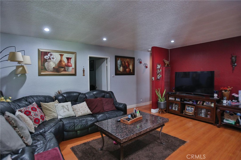 2525 West 10th Street Santa Ana, CA 92703 - Photo 13 of 37 a living room with furniture and a flat screen tv