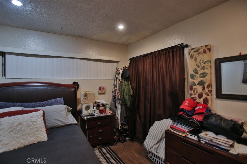 2525 West 10th Street Santa Ana, CA 92703 - Photo 14 of 37 a bed room with a bed and a television
