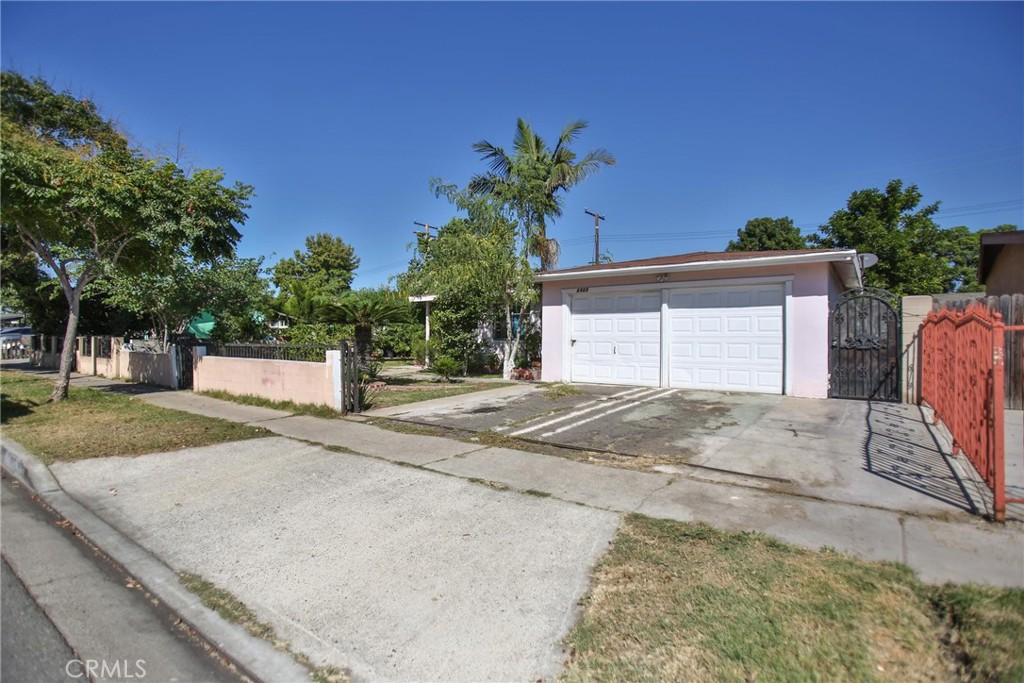 2525 West 10th Street Santa Ana, CA 92703 - Photo 17 of 37 a front view of a house with a yard and garage