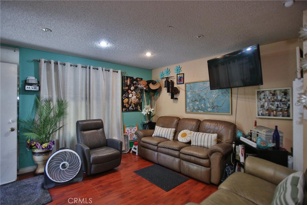 2525 West 10th Street Santa Ana, CA 92703 - Photo 21 of 37 a living room with furniture and a flat screen tv
