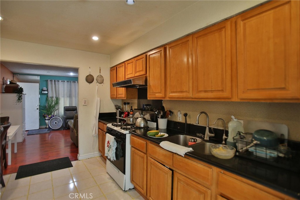 2525 West 10th Street Santa Ana, CA 92703 - Photo 29 of 37 a kitchen with sink cabinets and appliances
