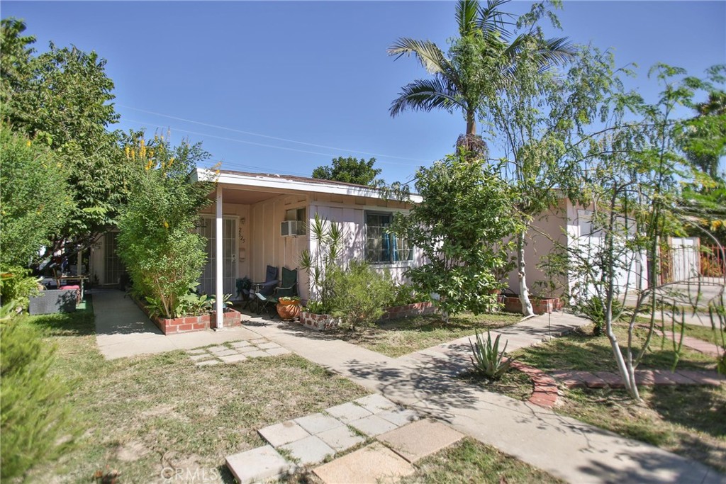 2525 West 10th Street Santa Ana, CA 92703 - Photo 3 of 37 a view of a house with yard and tree s