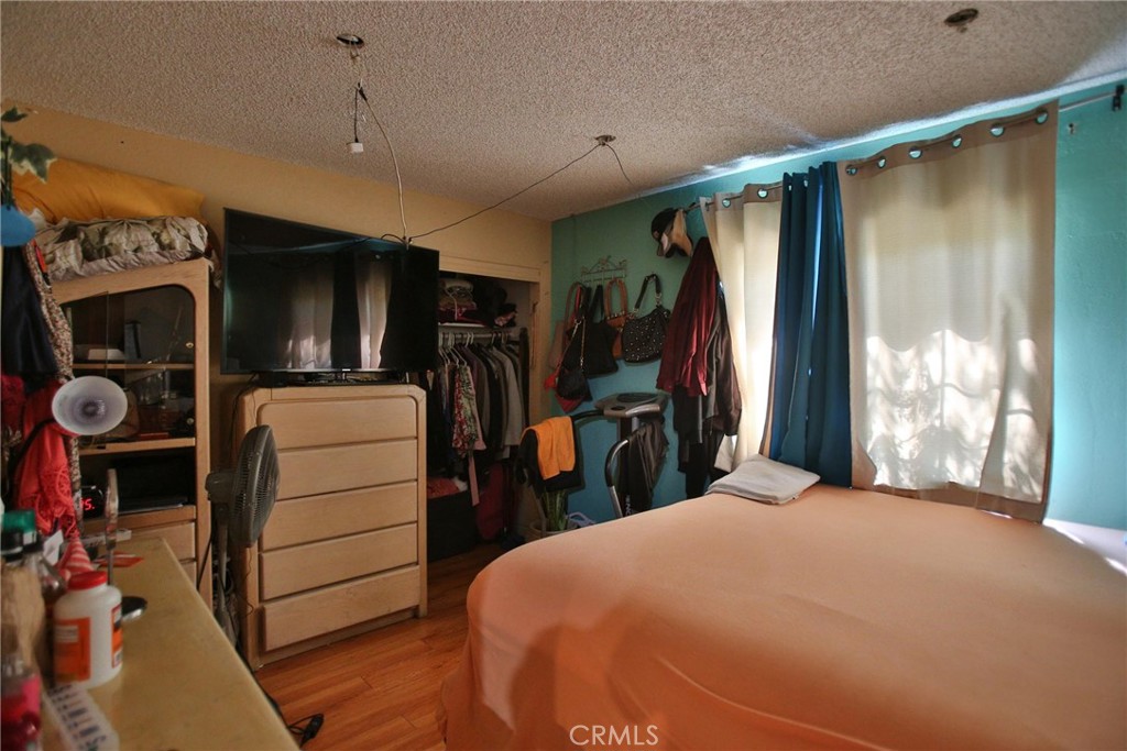 2525 West 10th Street Santa Ana, CA 92703 - Photo 31 of 37 a bed room with a bed and a mirror