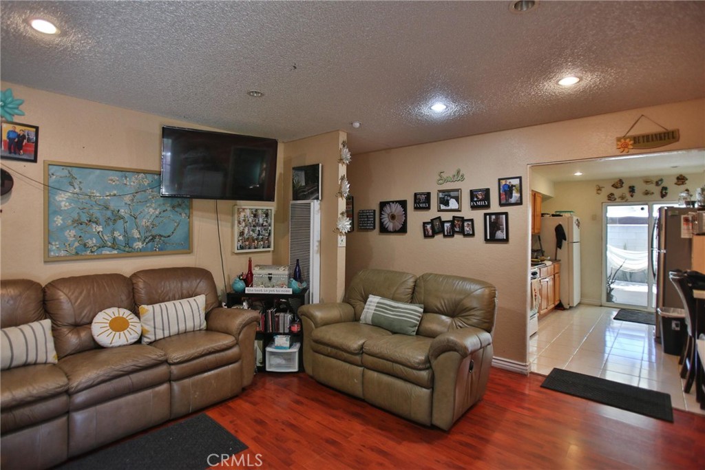 2525 West 10th Street Santa Ana, CA 92703 - Photo 33 of 37 a living room with furniture and a flat screen tv