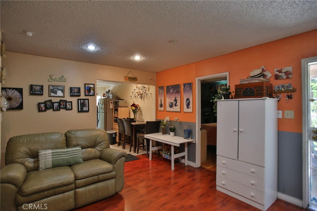 2525 West 10th Street Santa Ana, CA 92703 - Photo 34 of 37 a living room with furniture and wooden floor