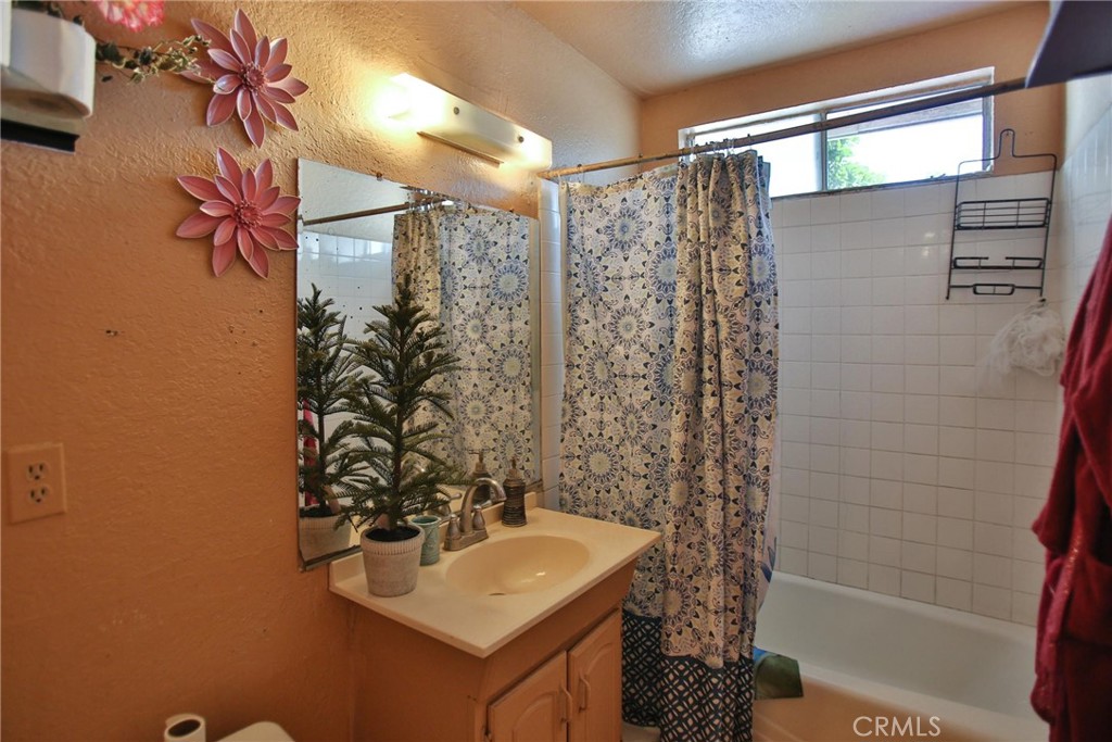 2525 West 10th Street Santa Ana, CA 92703 - Photo 36 of 37 a bathroom with a sink a toilet and shower