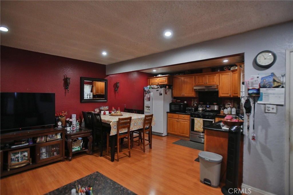 2525 West 10th Street Santa Ana, CA 92703 - Photo 9 of 37 a living room with furniture and a flat screen tv