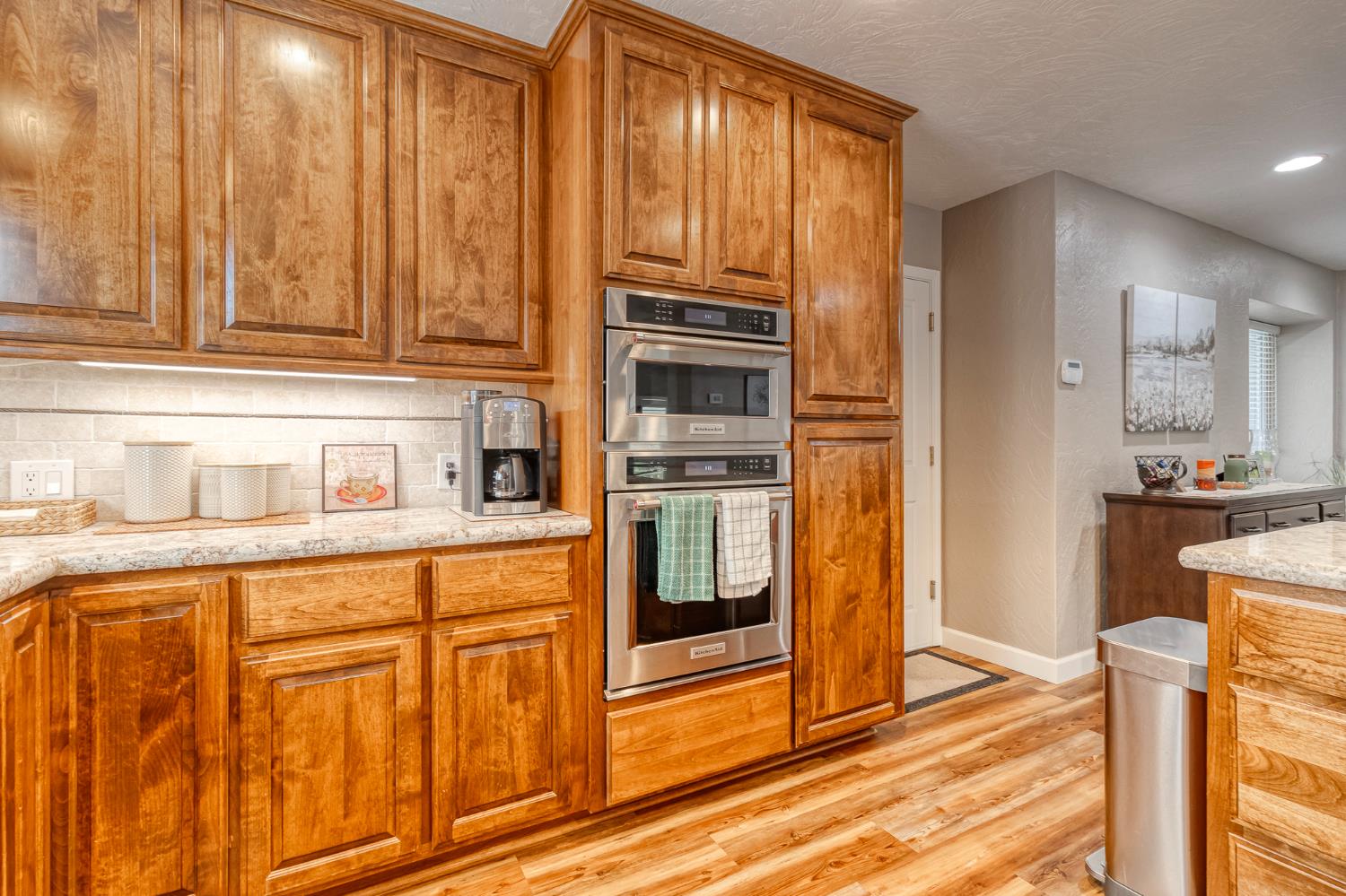 1512 Kruger Drive Modesto, CA 95355 - Photo 16 of 33 a kitchen with stainless steel appliances granite countertop a refrigerator and cabinets