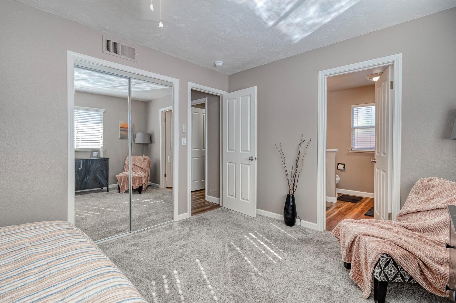 1512 Kruger Drive Modesto, CA 95355 - Photo 23 of 33 a bedroom with furniture and a mirror