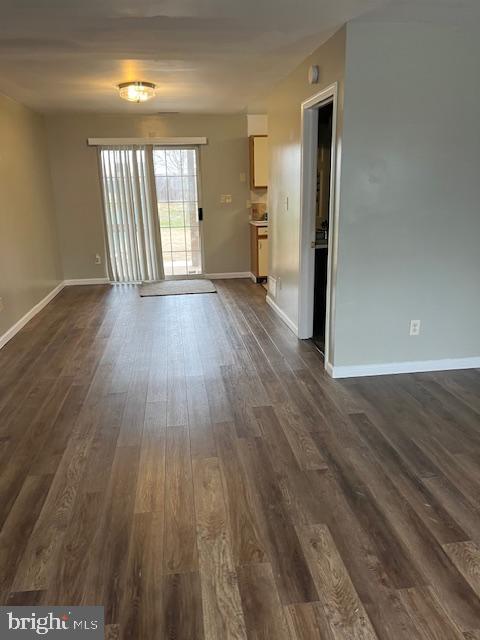 1012 9th Street Newark, DE 19711 - Photo 3 of 7 wooden floor in an empty room with a window