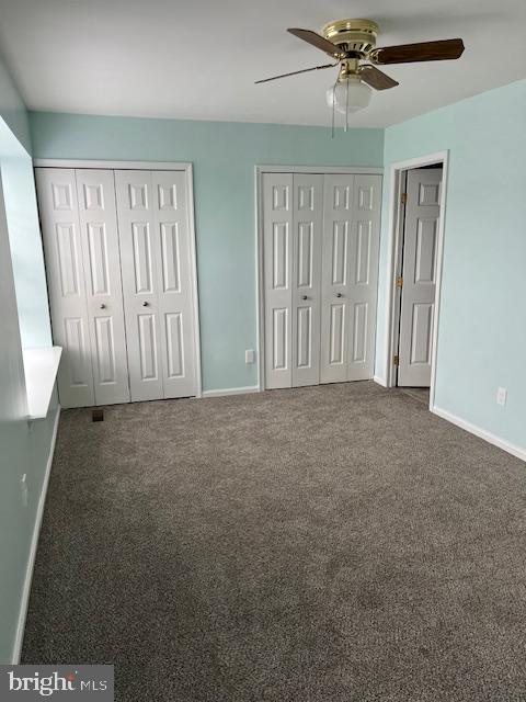 1012 9th Street Newark, DE 19711 - Photo 6 of 7 en empty room with windows and fan