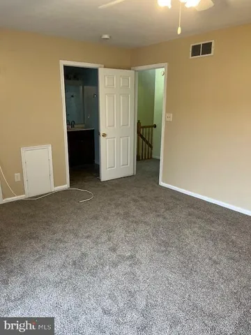 an empty room with closet and area