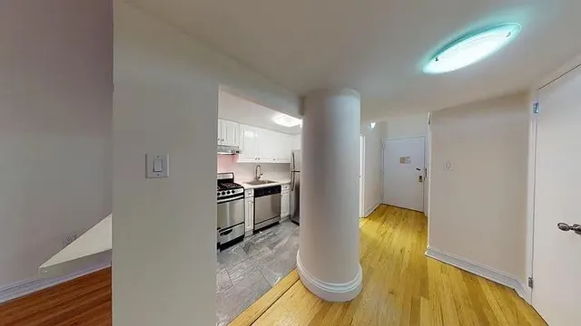 a view of kitchen and dining area with furniture