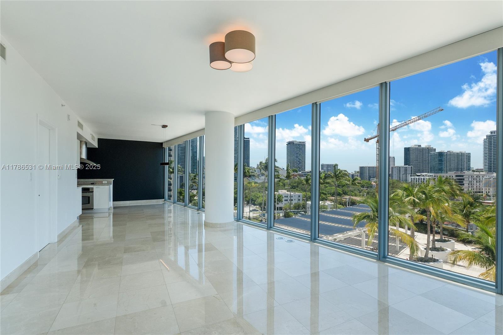601 Northeast 36th Street, Unit 801 Miami, FL 33137 - Photo 2 of 24 a view of a big room with balcony and furniture