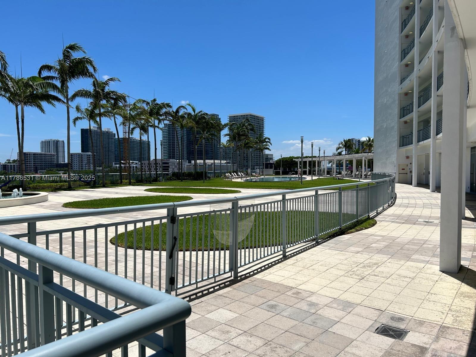 601 Northeast 36th Street, Unit 801 Miami, FL 33137 - Photo 21 of 24 a view of swimming pool with outdoor seating and city view