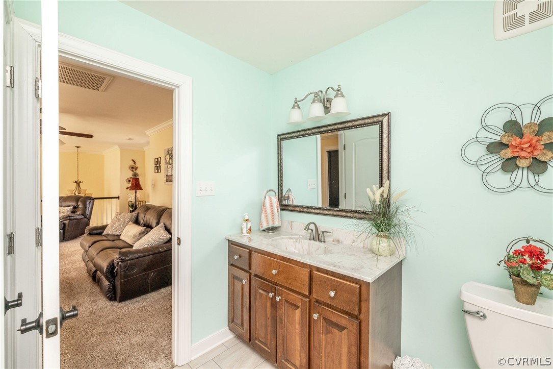 20155 Templeton Road Carson, VA 23830 - Photo 36 of 50 a en suite bathroom with a double vanity sink and a mirror