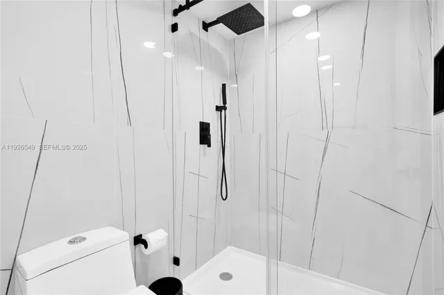 a bathroom with a shower and a sink