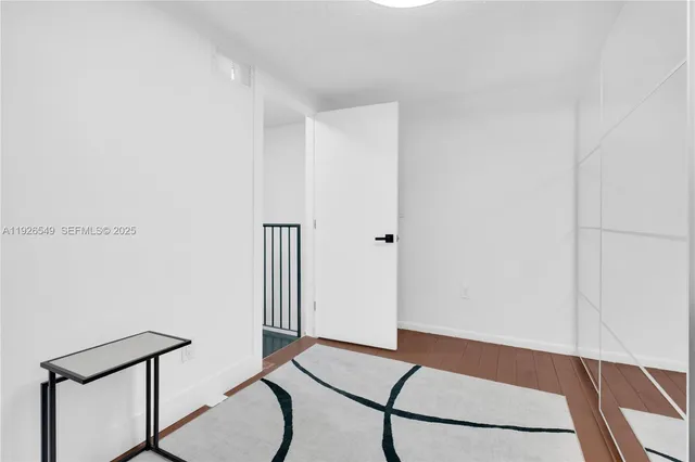 a room with a table and a potted plant