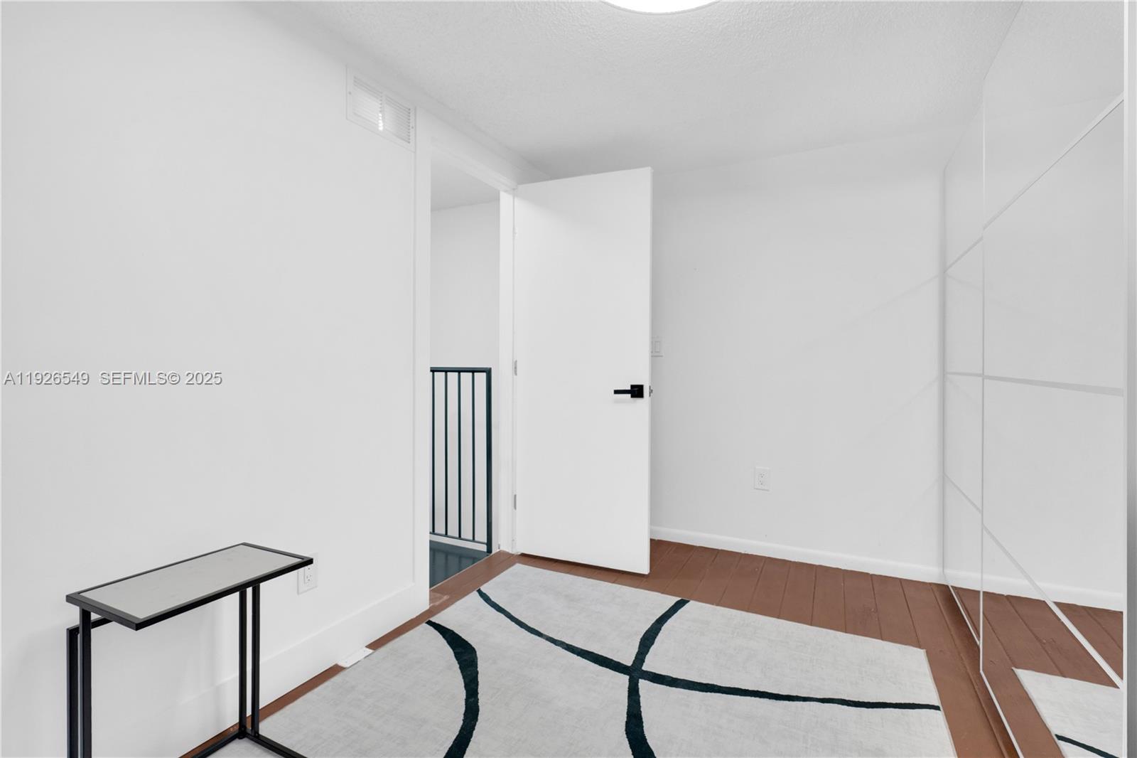 13028 Southwest 88th Lane, Unit A205 Miami, FL 33186 - Photo 29 of 37 a room with a table and a potted plant