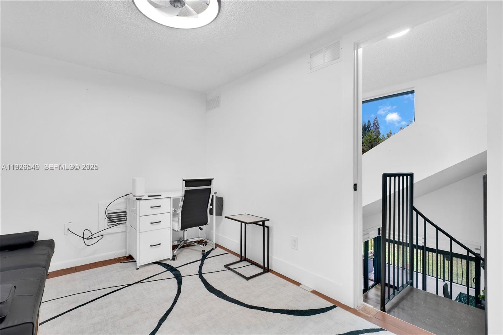 13028 Southwest 88th Lane, Unit A205 Miami, FL 33186 - Photo 30 of 37 a room with furniture and white walls