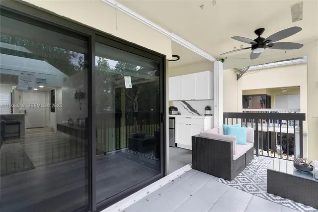 a living room with couches a coffee table and a fireplace
