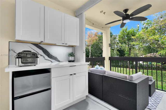 a kitchen with a window a sink and cabinets