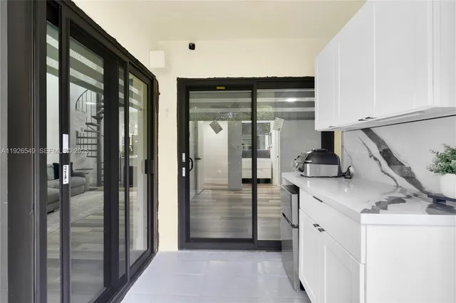 a kitchen with a sink and refrigerator