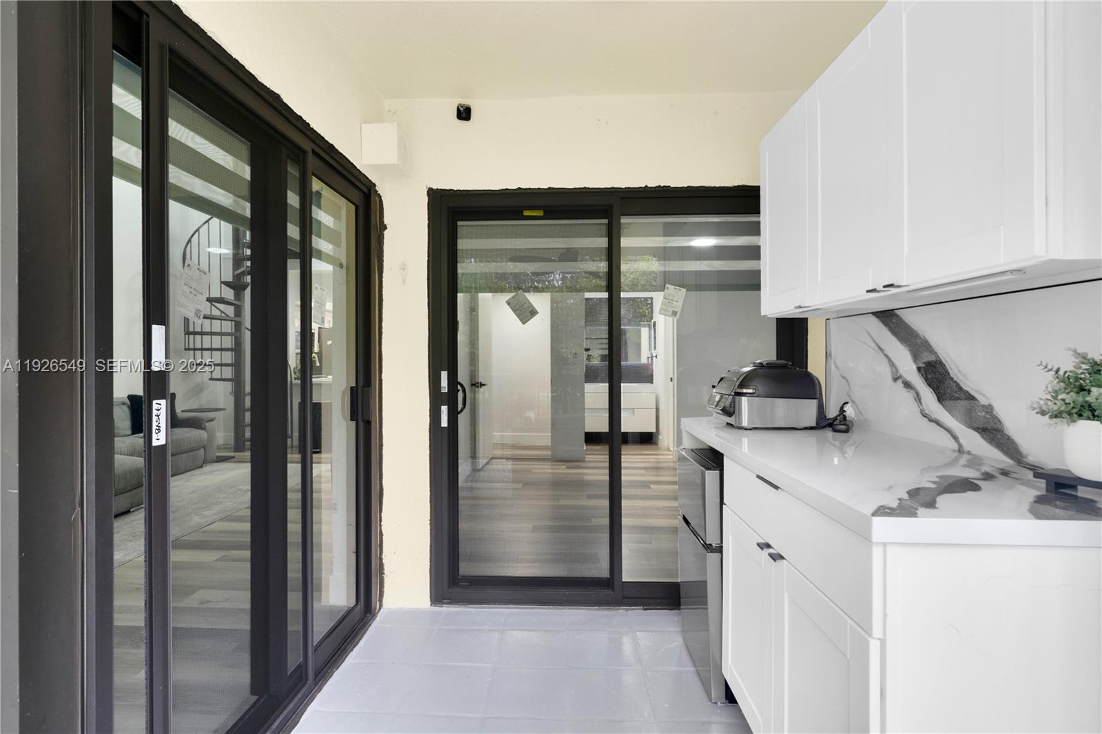 13028 Southwest 88th Lane, Unit A205 Miami, FL 33186 - Photo 34 of 37 a kitchen with a sink and refrigerator