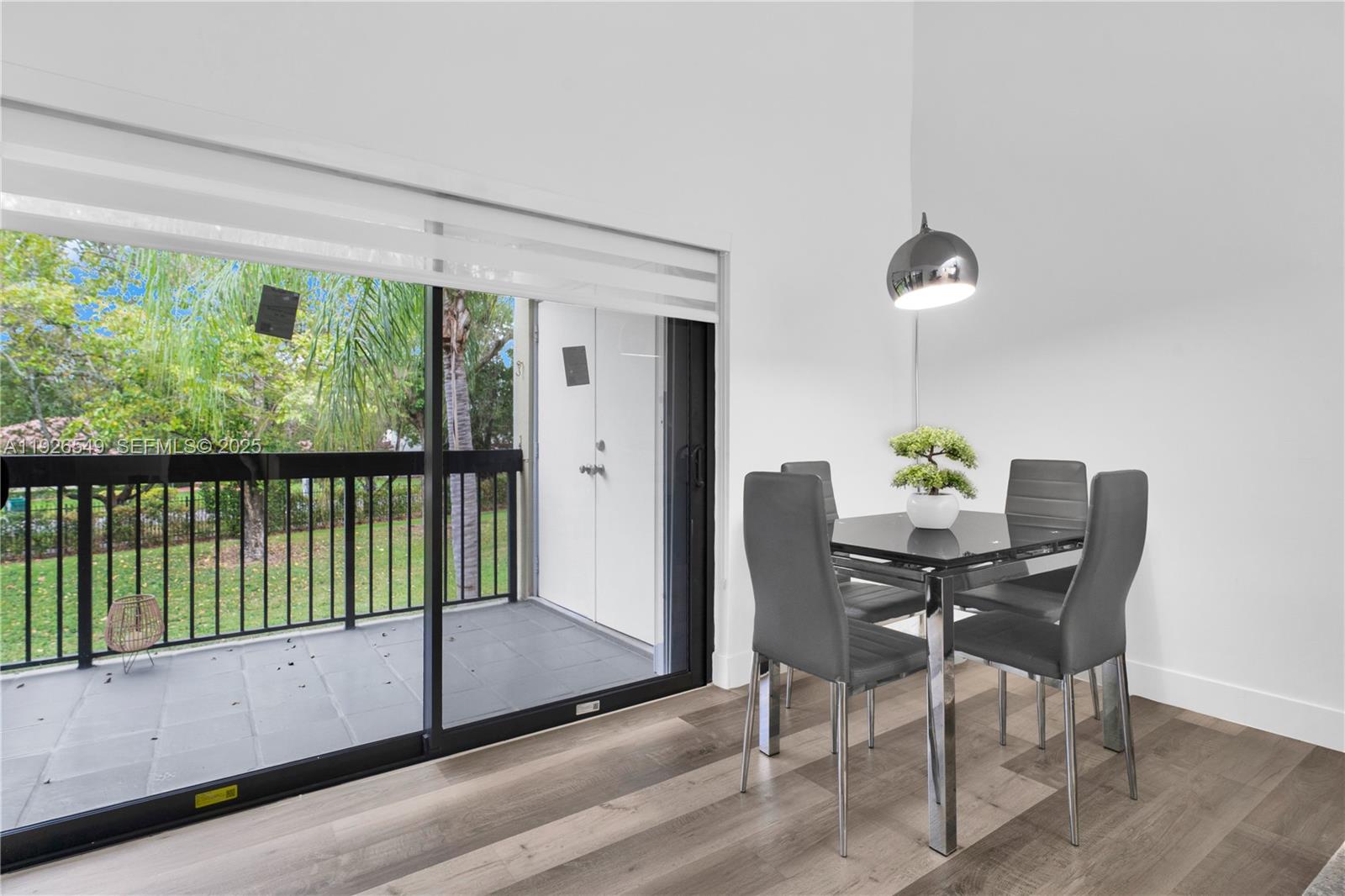 13028 Southwest 88th Lane, Unit A205 Miami, FL 33186 - Photo 10 of 37 a dining room with furniture and window