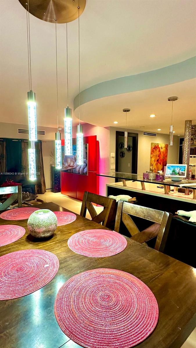 18880 Northwest 57th Avenue, Unit 208 Hialeah, FL 33015 - Photo 4 of 28 a kitchen with table and chairs