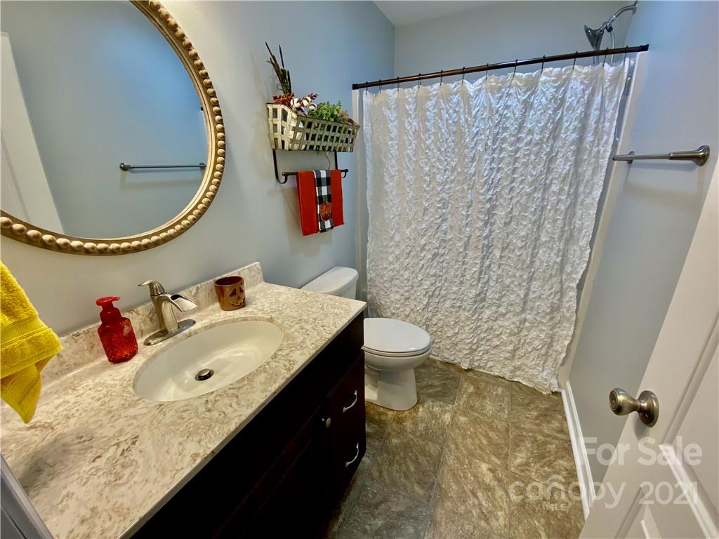 6316 Bill Sain Road Vale, NC 28168 - Photo 8 of 15 a bathroom with a sink toilet and a mirror