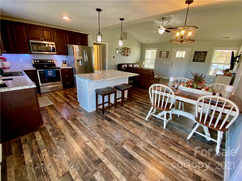 6316 Bill Sain Road Vale, NC 28168 - Photo 10 of 15 a large kitchen with a table and chairs in it