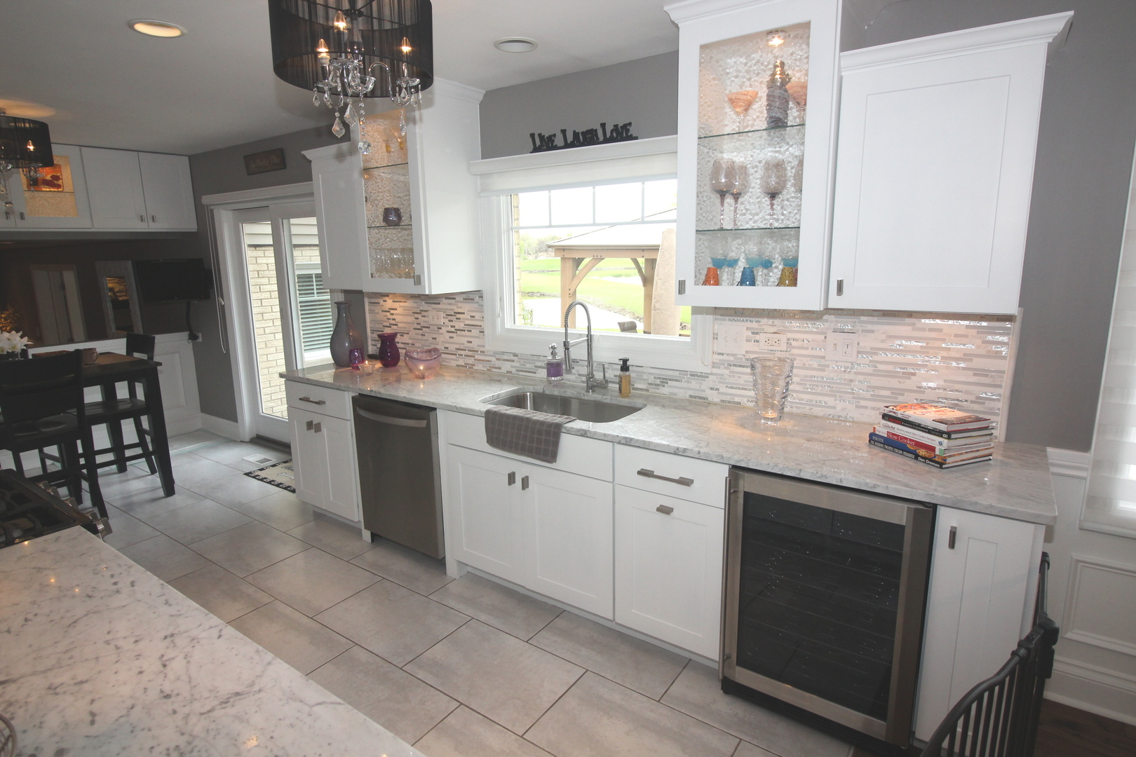 913 Surrey Road Addison, IL 60101 - Photo 11 of 44 a kitchen with a sink cabinets and window